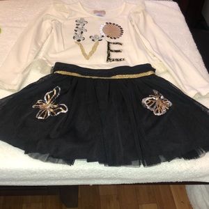 Girls long sleev shirt and skirt.